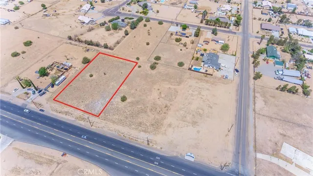 wooden floor with view of living room
