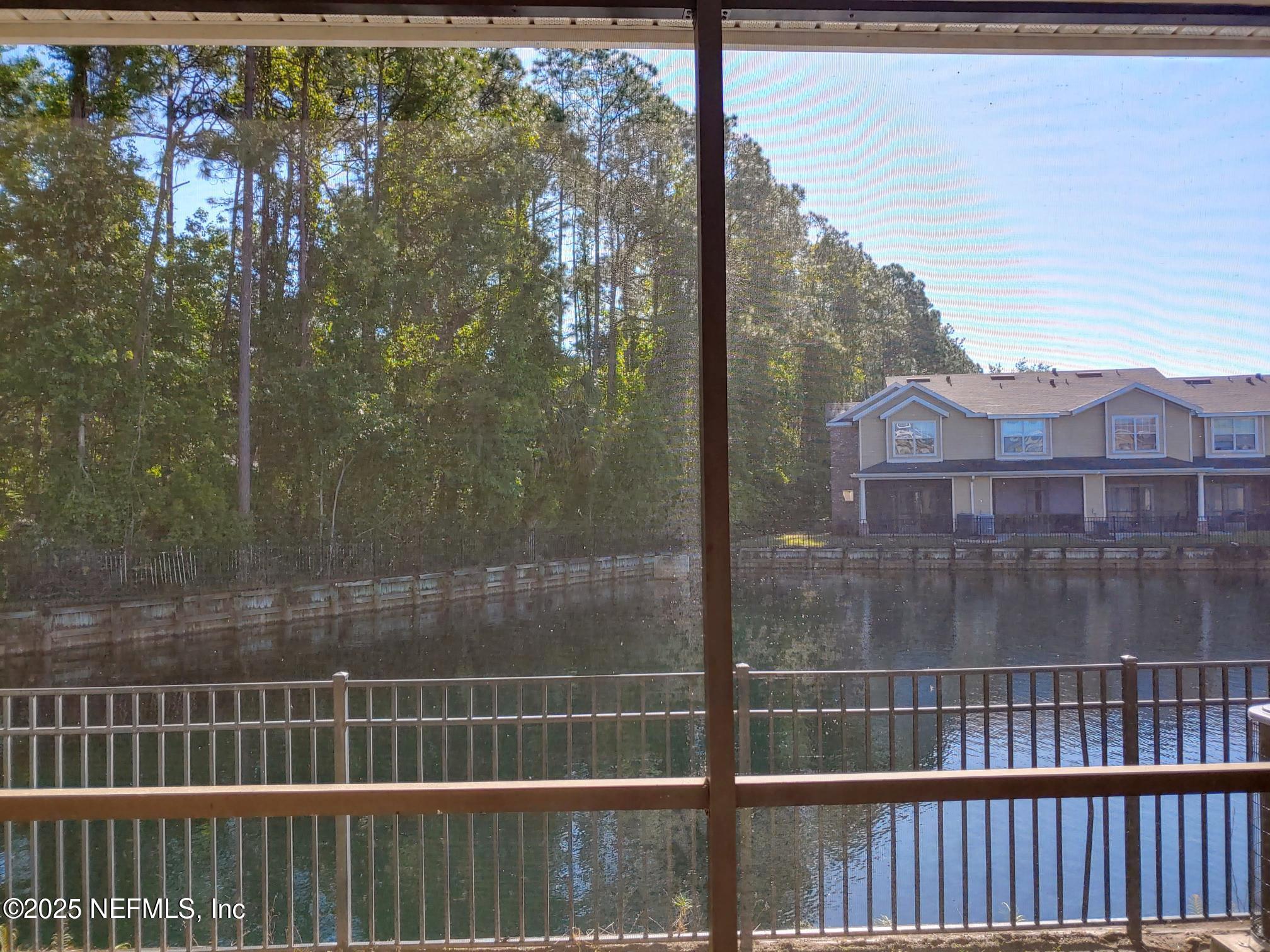10200 Belle Rive Boulevard, Unit 3605 Jacksonville, FL 32256 - Photo 31 of 34 a view of a balcony with a swing