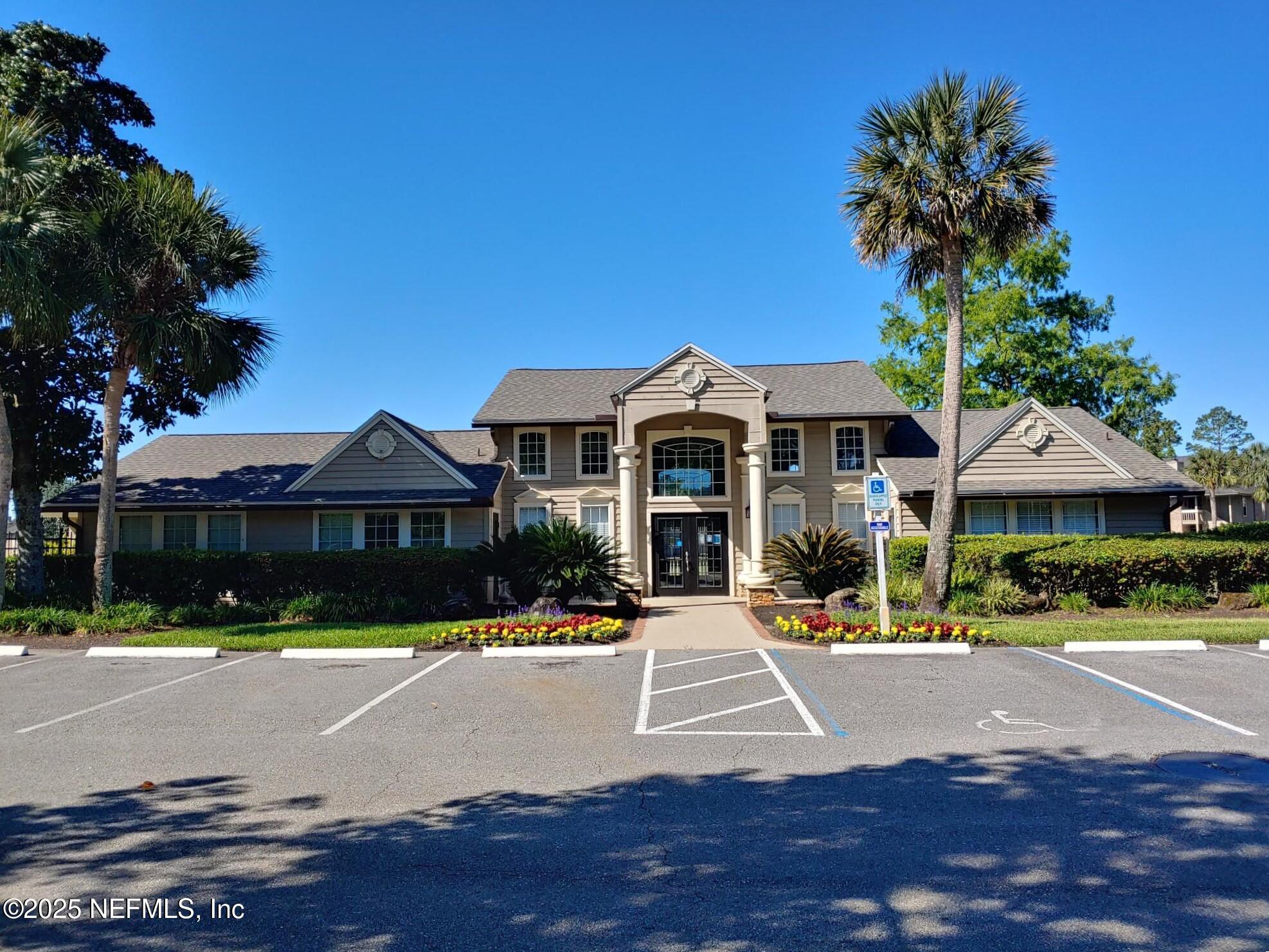 10200 Belle Rive Boulevard, Unit 3605 Jacksonville, FL 32256 - Photo 32 of 34 a front view of a building with street view and trees