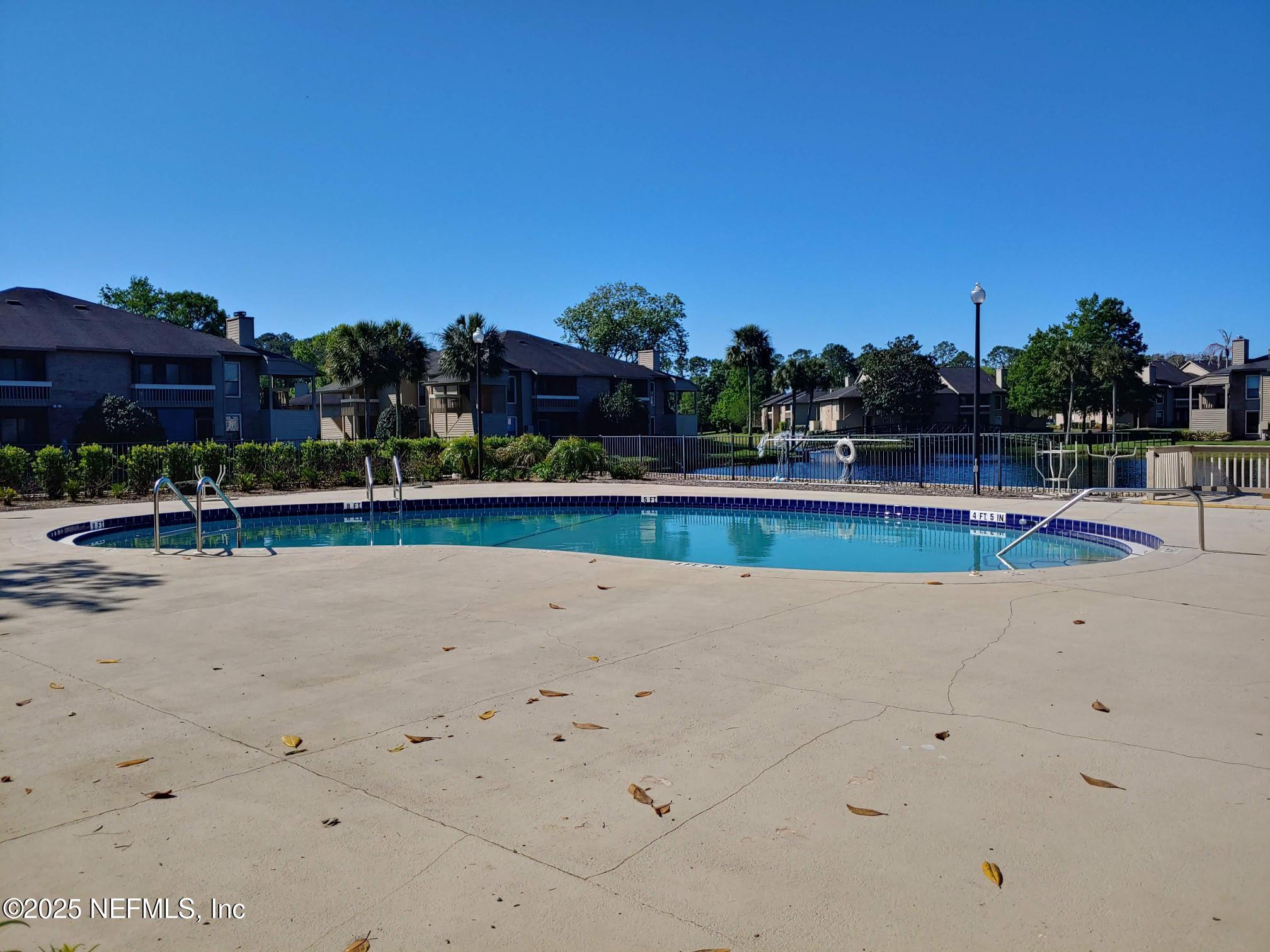 10200 Belle Rive Boulevard, Unit 3605 Jacksonville, FL 32256 - Photo 33 of 34 a view of a swimming pool