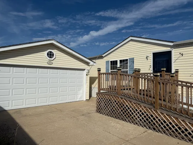 a front view of a house with garage