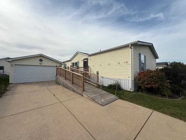 a view of house along with trees in front of main door