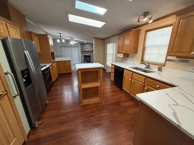 a large kitchen with a large window