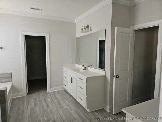 a utility room with cabinets washer and dryer