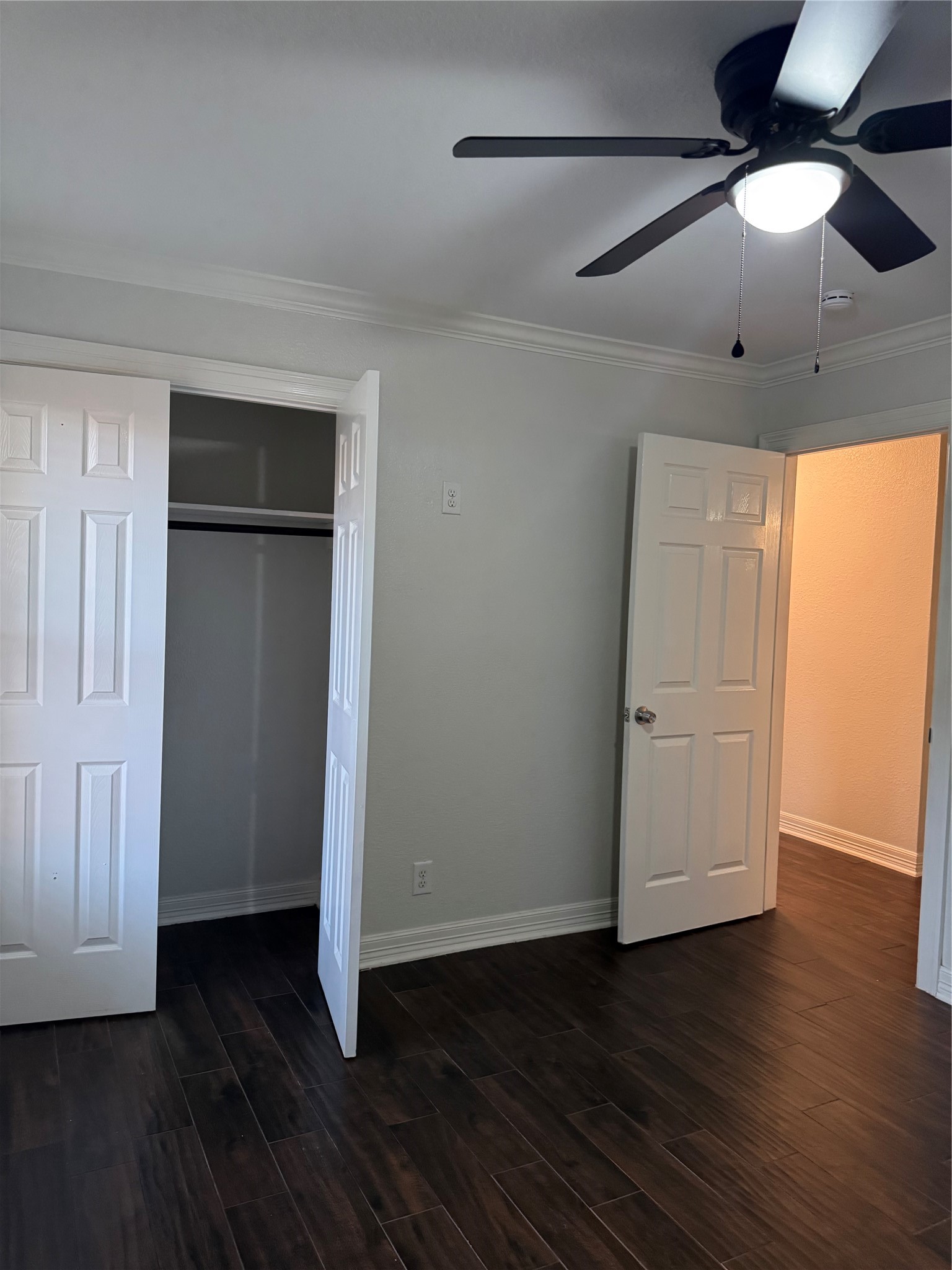 534 Sulphur Street Houston, TX 77034 - Photo 12 of 46 an empty room with wooden floor cabinet and windows