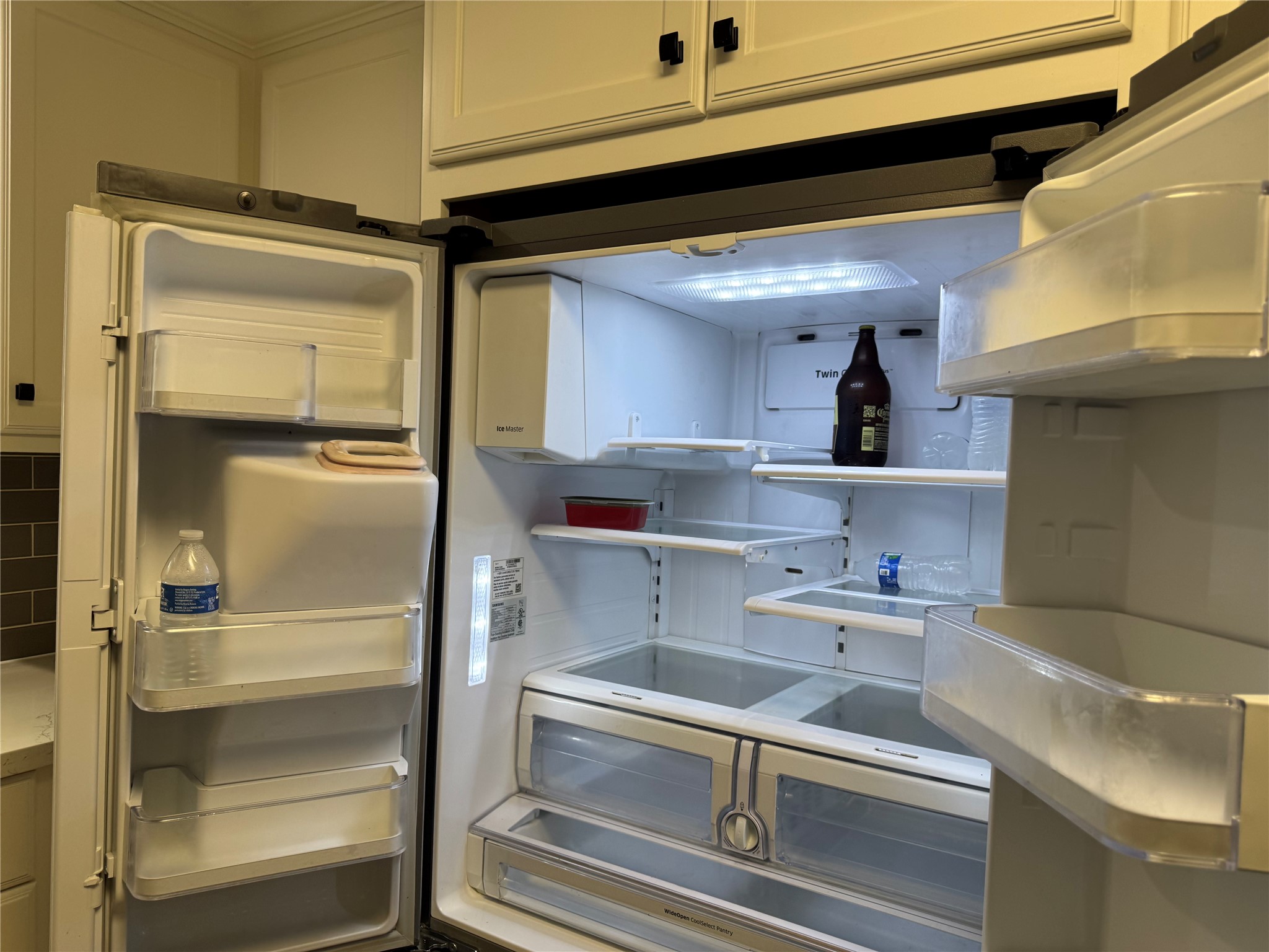 534 Sulphur Street Houston, TX 77034 - Photo 33 of 46 a kitchen with a refrigerator and cabinets