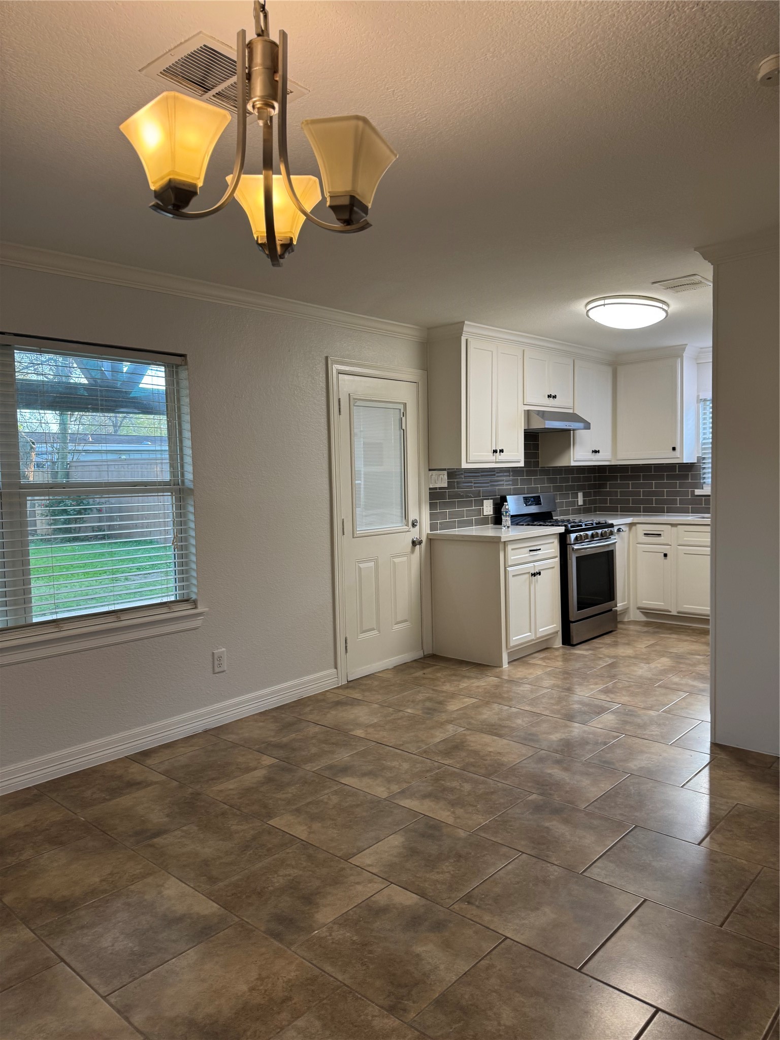 534 Sulphur Street Houston, TX 77034 - Photo 39 of 46 a kitchen with stainless steel appliances granite countertop a stove top oven a sink dishwasher and a refrigerator with wooden floor
