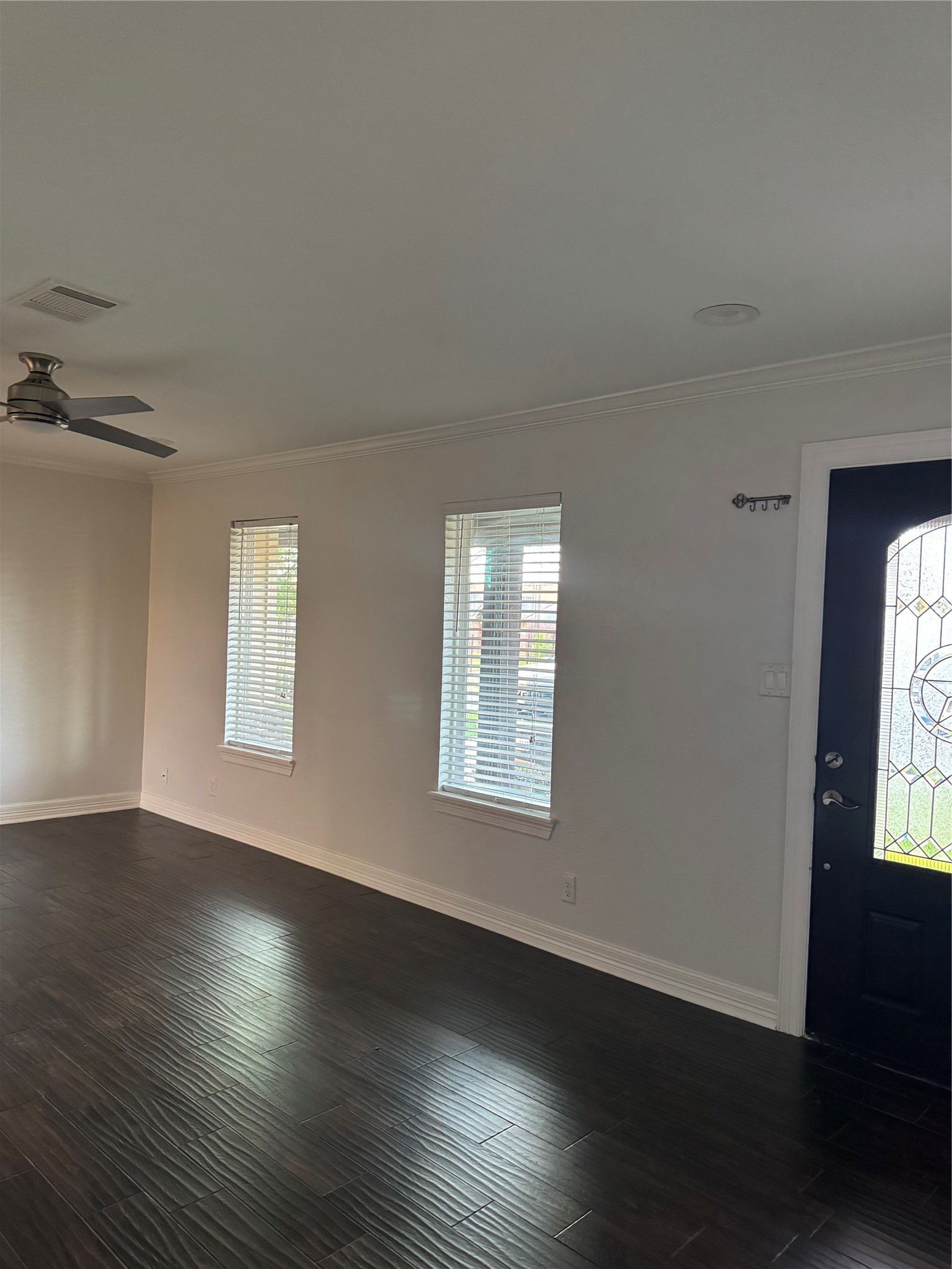 534 Sulphur Street Houston, TX 77034 - Photo 41 of 46 an empty room with wooden floor and windows