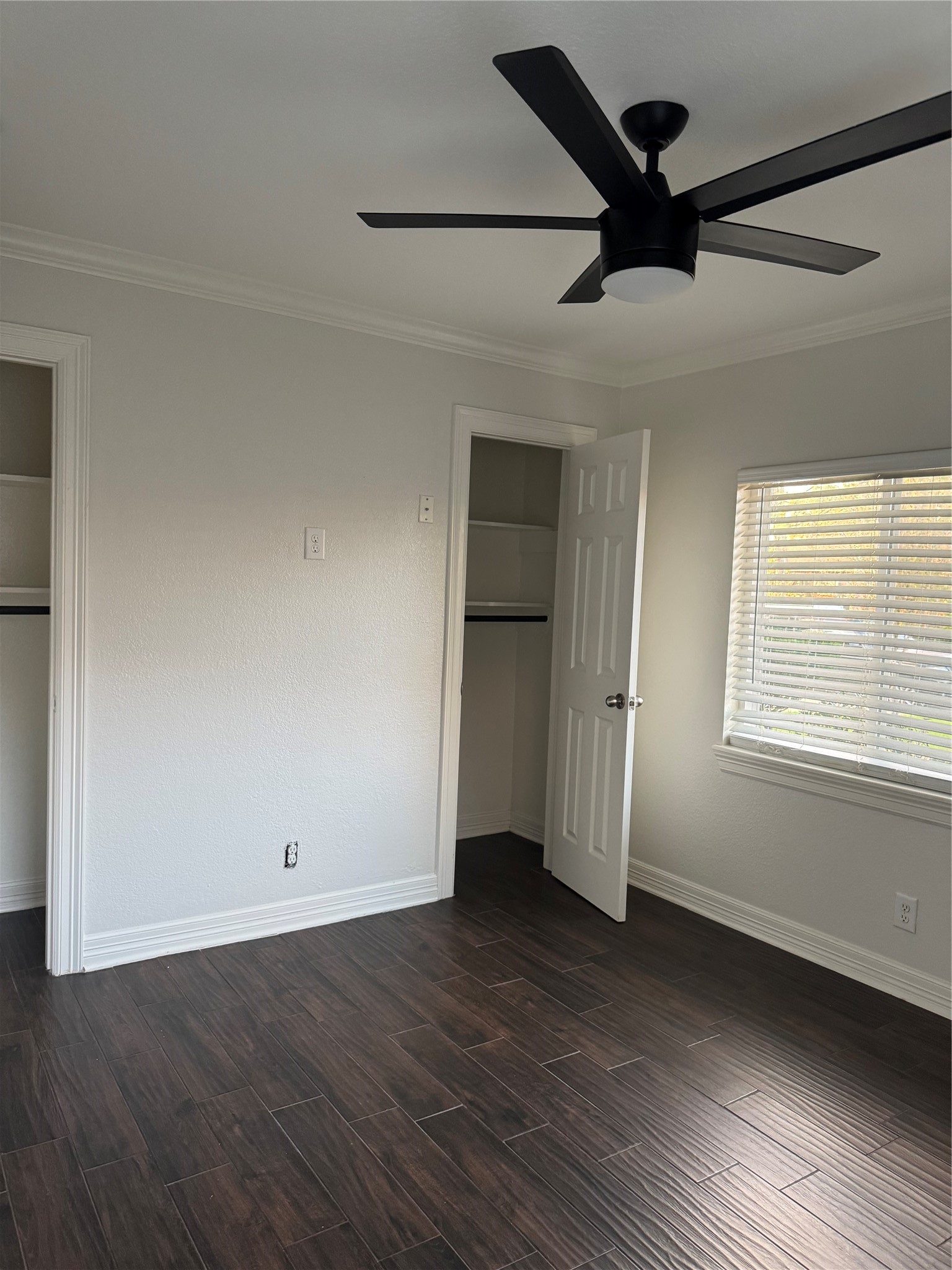 534 Sulphur Street Houston, TX 77034 - Photo 46 of 46 an empty room with wooden floor ceiling fan and windows