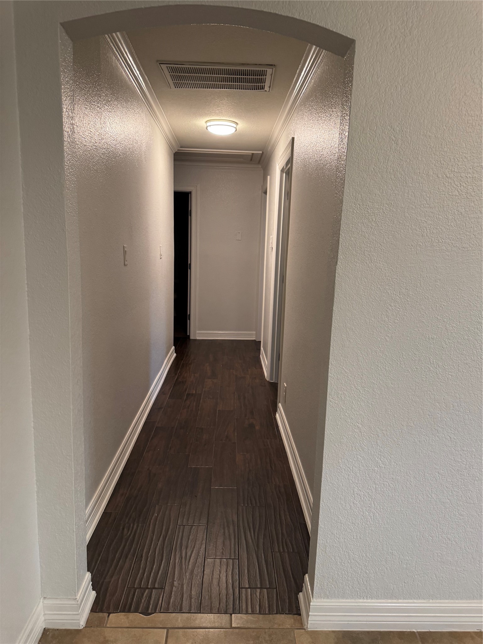 534 Sulphur Street Houston, TX 77034 - Photo 6 of 46 a view of a hallway with wooden floor