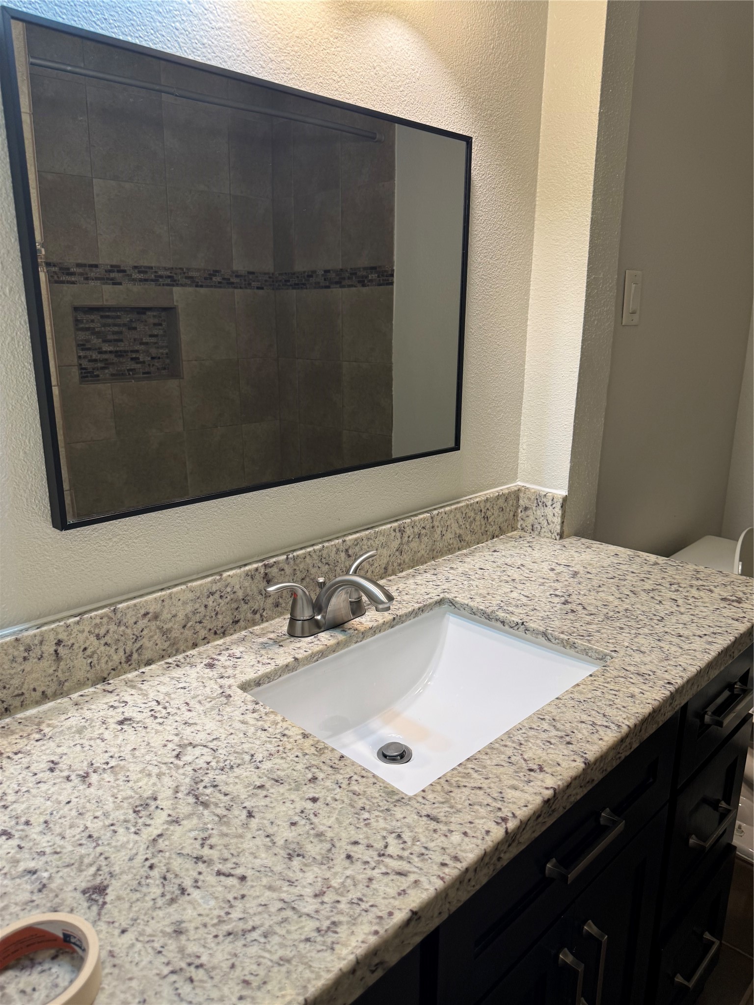 534 Sulphur Street Houston, TX 77034 - Photo 10 of 46 a bathroom with a granite countertop sink and a mirror