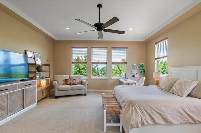 a bedroom with a bed and a couch