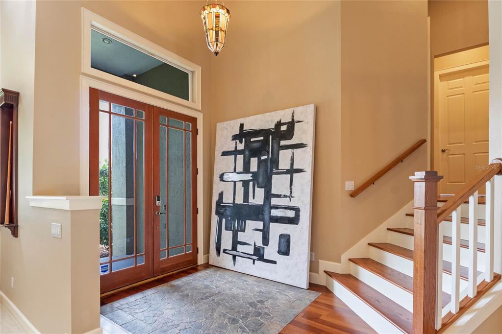 16940 Apopka Springs Boulevard Montverde, FL 34756 - Photo 2 of 36 a view of a livingroom with stairs and furniture