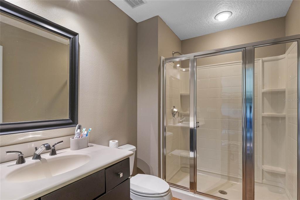 16940 Apopka Springs Boulevard Montverde, FL 34756 - Photo 24 of 36 a bathroom with a sink toilet and shower