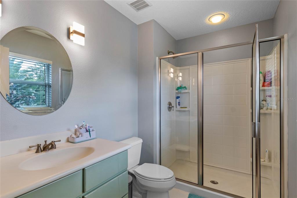 16940 Apopka Springs Boulevard Montverde, FL 34756 - Photo 26 of 36 a bathroom with a sink a toilet and shower