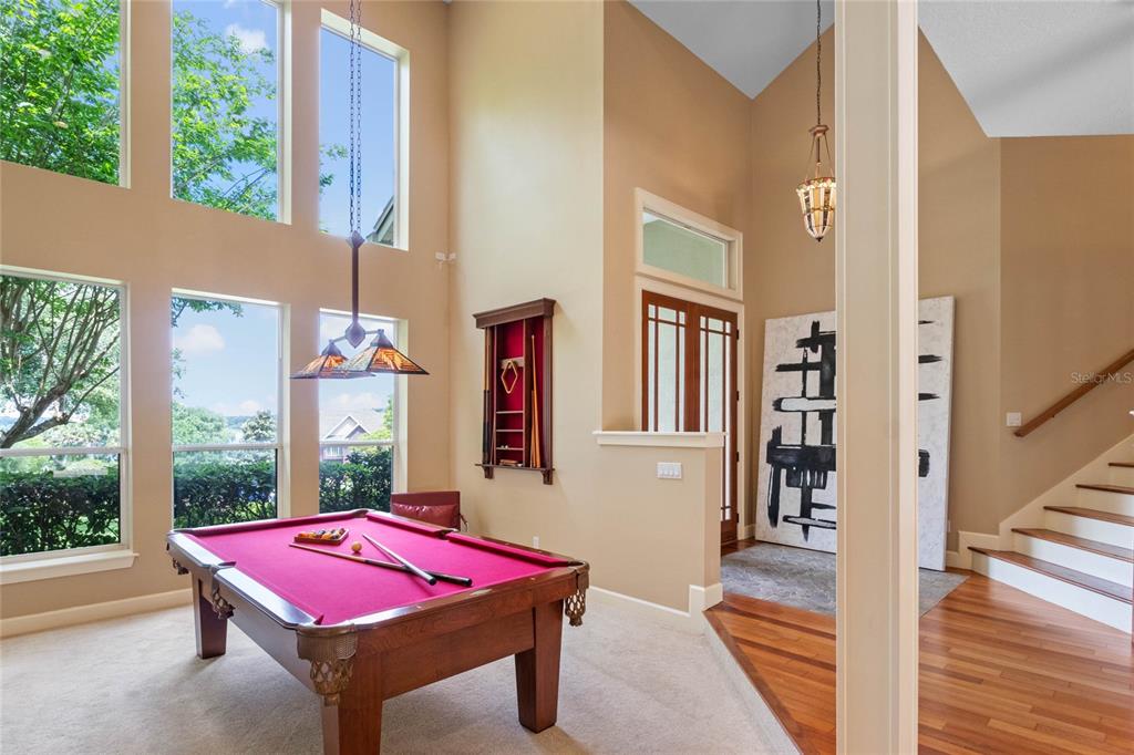 16940 Apopka Springs Boulevard Montverde, FL 34756 - Photo 3 of 36 a patio with table and chairs