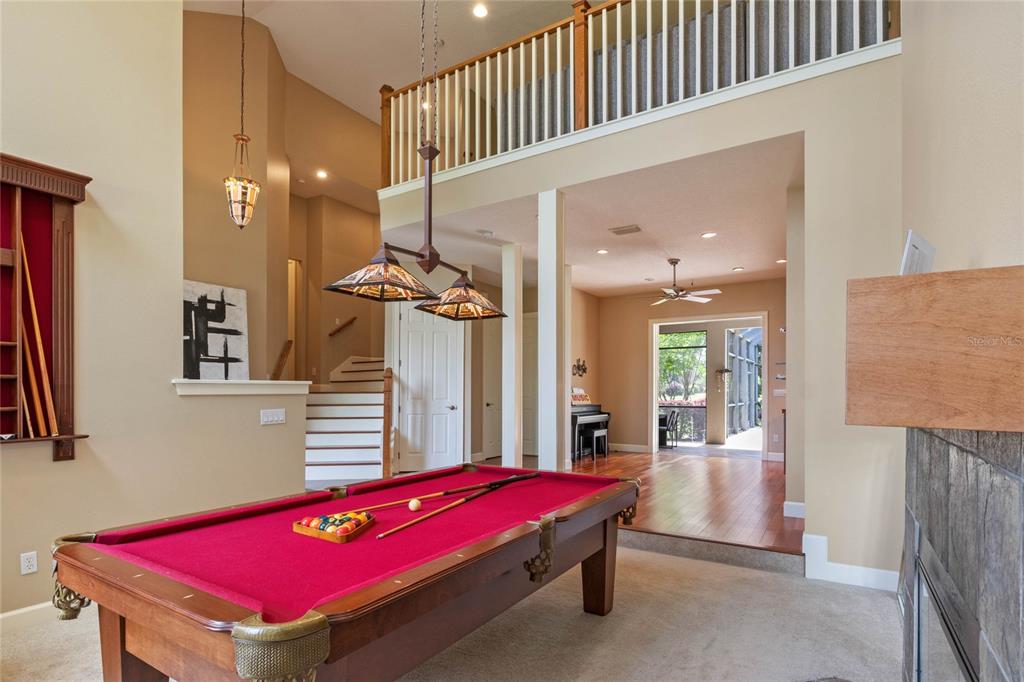 16940 Apopka Springs Boulevard Montverde, FL 34756 - Photo 4 of 36 a room with pool table and windows