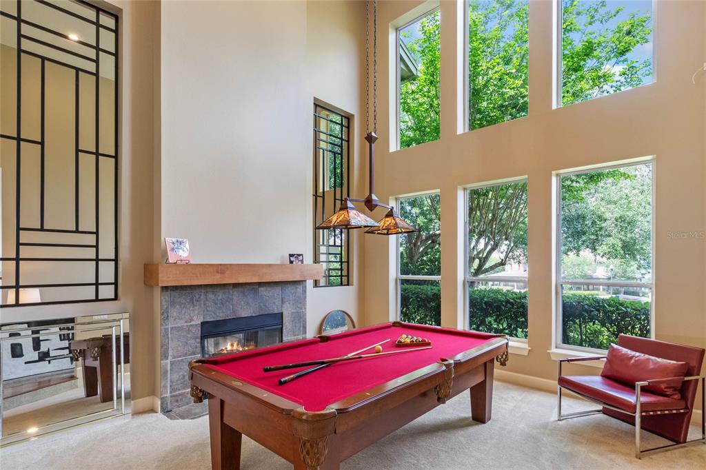 16940 Apopka Springs Boulevard Montverde, FL 34756 - Photo 5 of 36 a pool with a table and chairs in balcony