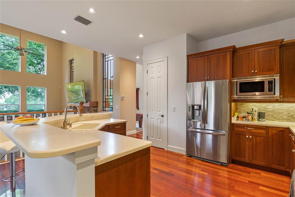 16940 Apopka Springs Boulevard Montverde, FL 34756 - Photo 8 of 36 a kitchen with granite countertop a sink appliances and cabinets