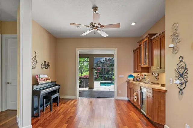 a kitchen with stainless steel appliances granite countertop a stove top oven a sink a window and a counter top space