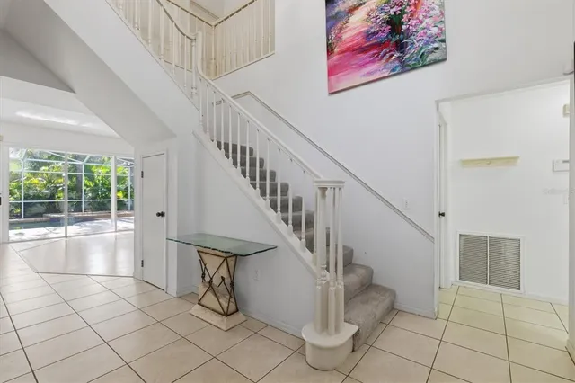 a view of empty room with wooden floor and fireplace
