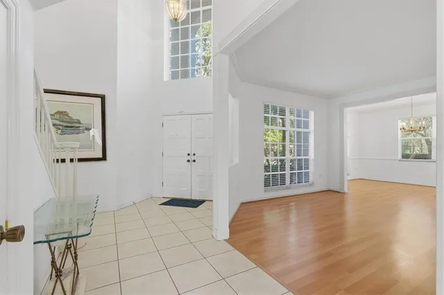 a view of a glass door with a floor to ceiling window wooden floor
