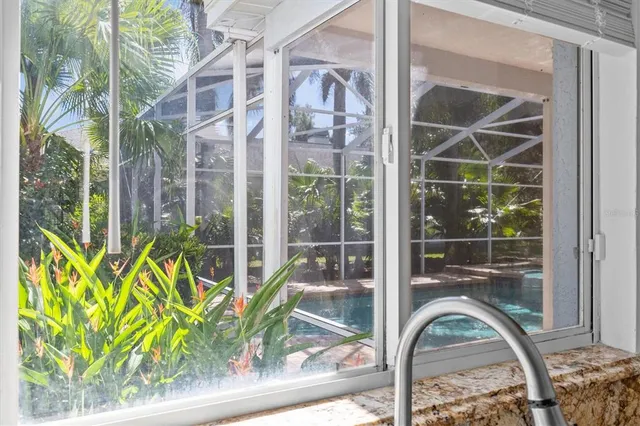 a living room with a bed furniture and a window