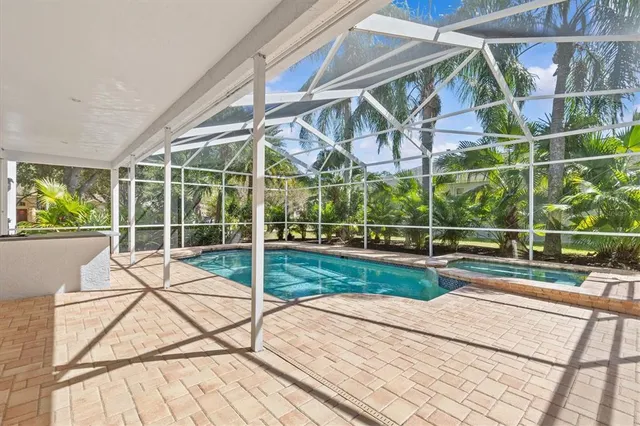 a bathroom with a shower sink vanity mirror and toilet