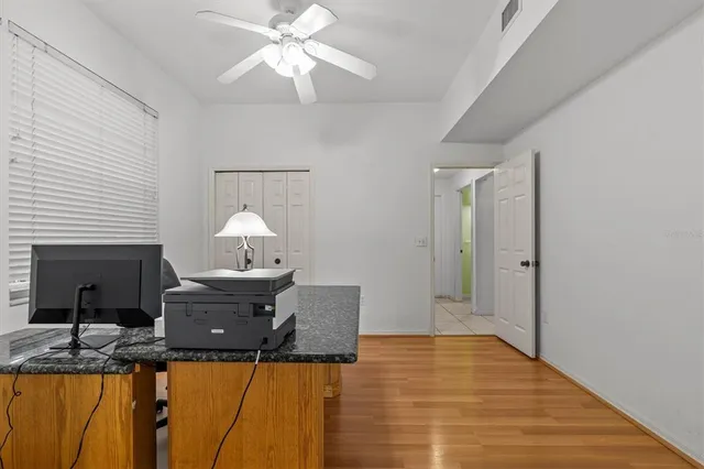 an aerial view of a house with a yard basket ball court and outdoor seating