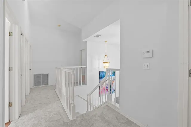 an aerial view of a tennis ground and a yard