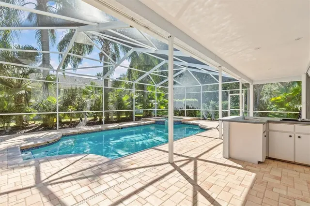 a kitchen with stainless steel appliances granite countertop a sink stove and microwave