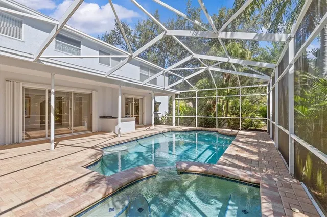 a kitchen with stainless steel appliances granite countertop a sink dishwasher and a stove with granite countertops