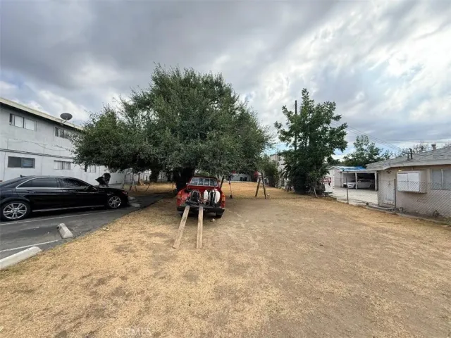 a view of street with parked cars