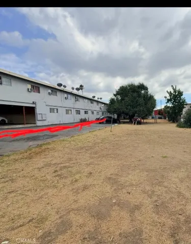 a view of play ground with multi story residential houses