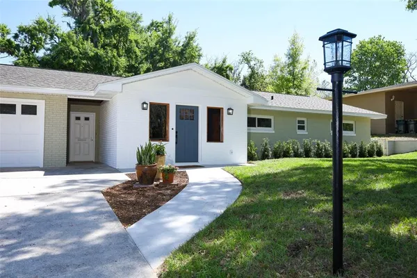 a front view of a house with garden