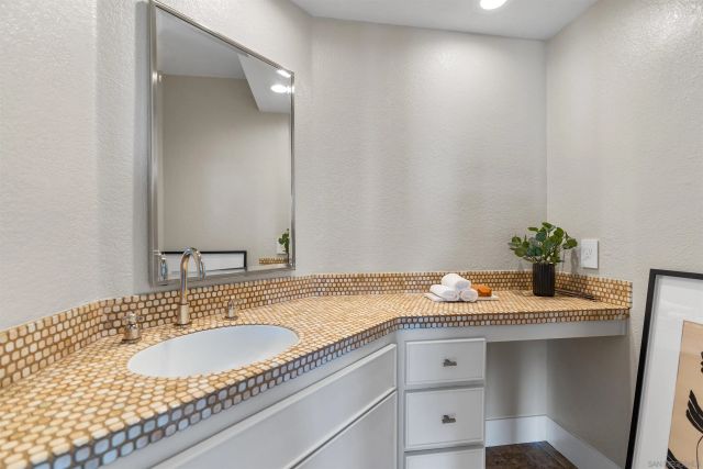 a spacious bedroom with a bed and a large window