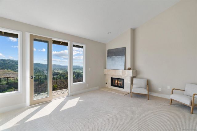 a spacious bathroom with a tub shower and windows