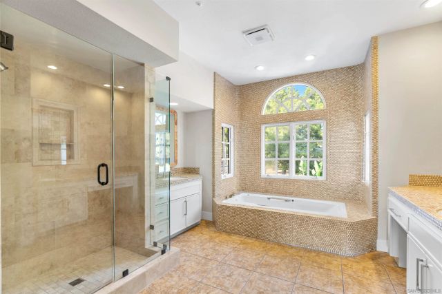 a view of a balcony with two chairs and a potted plant