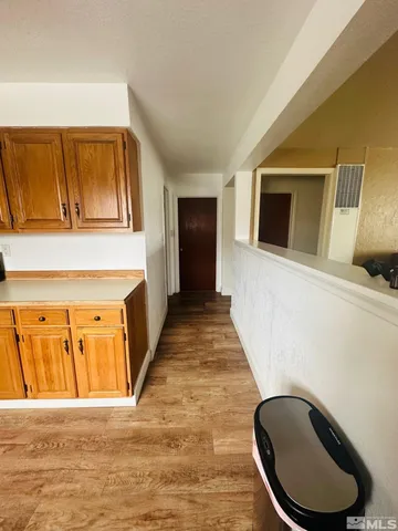 a kitchen with stainless steel appliances kitchen island granite countertop a sink and cabinets