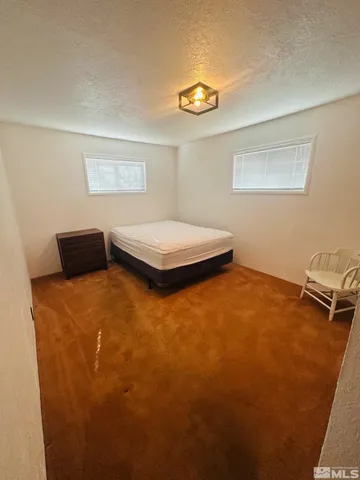 a bedroom with a bed and furniture