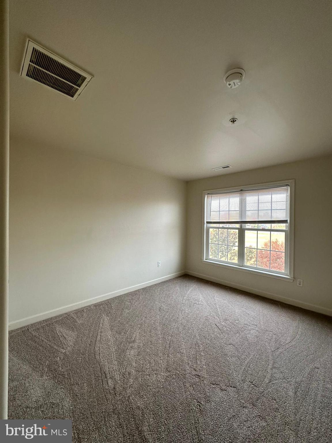 5409 Commerce Row, Unit 49 Bowie, MD 20720 - Photo 17 of 22 an empty room with windows