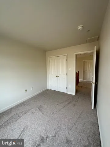 a view of an empty room and a window