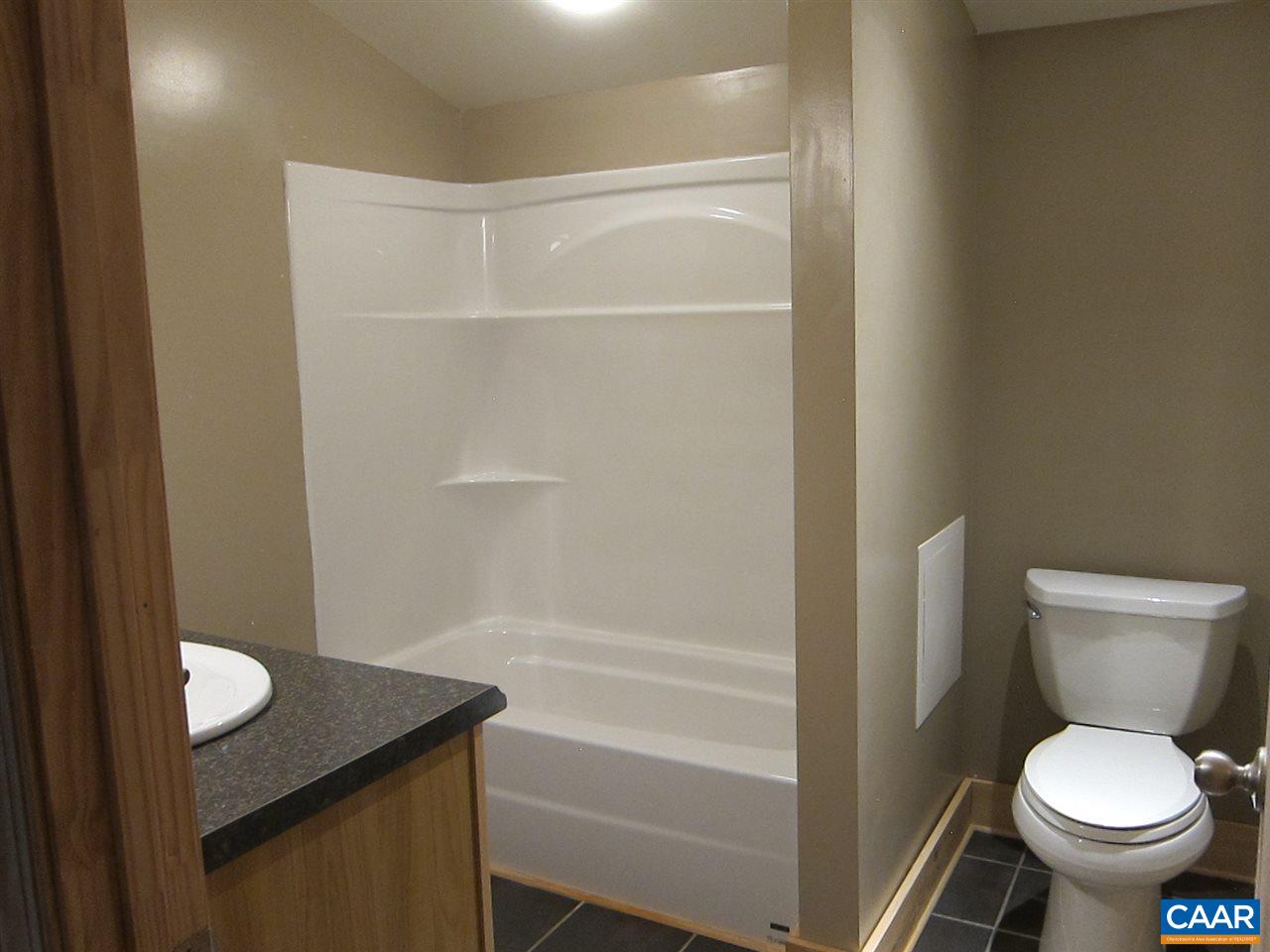 4176 Rising Sun Road Palmyra, VA 22963 - Photo 17 of 26 a bathroom with a sink and toilet
