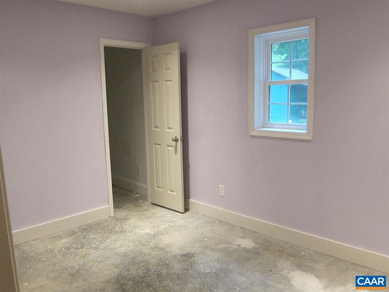 4176 Rising Sun Road Palmyra, VA 22963 - Photo 19 of 26 an empty room with windows and closet