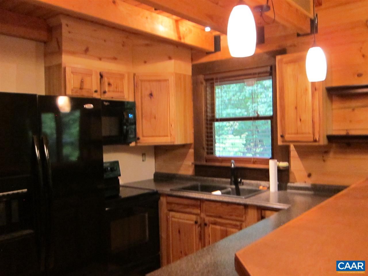 4176 Rising Sun Road Palmyra, VA 22963 - Photo 3 of 26 a kitchen with stainless steel appliances granite countertop a sink a stove and a refrigerator