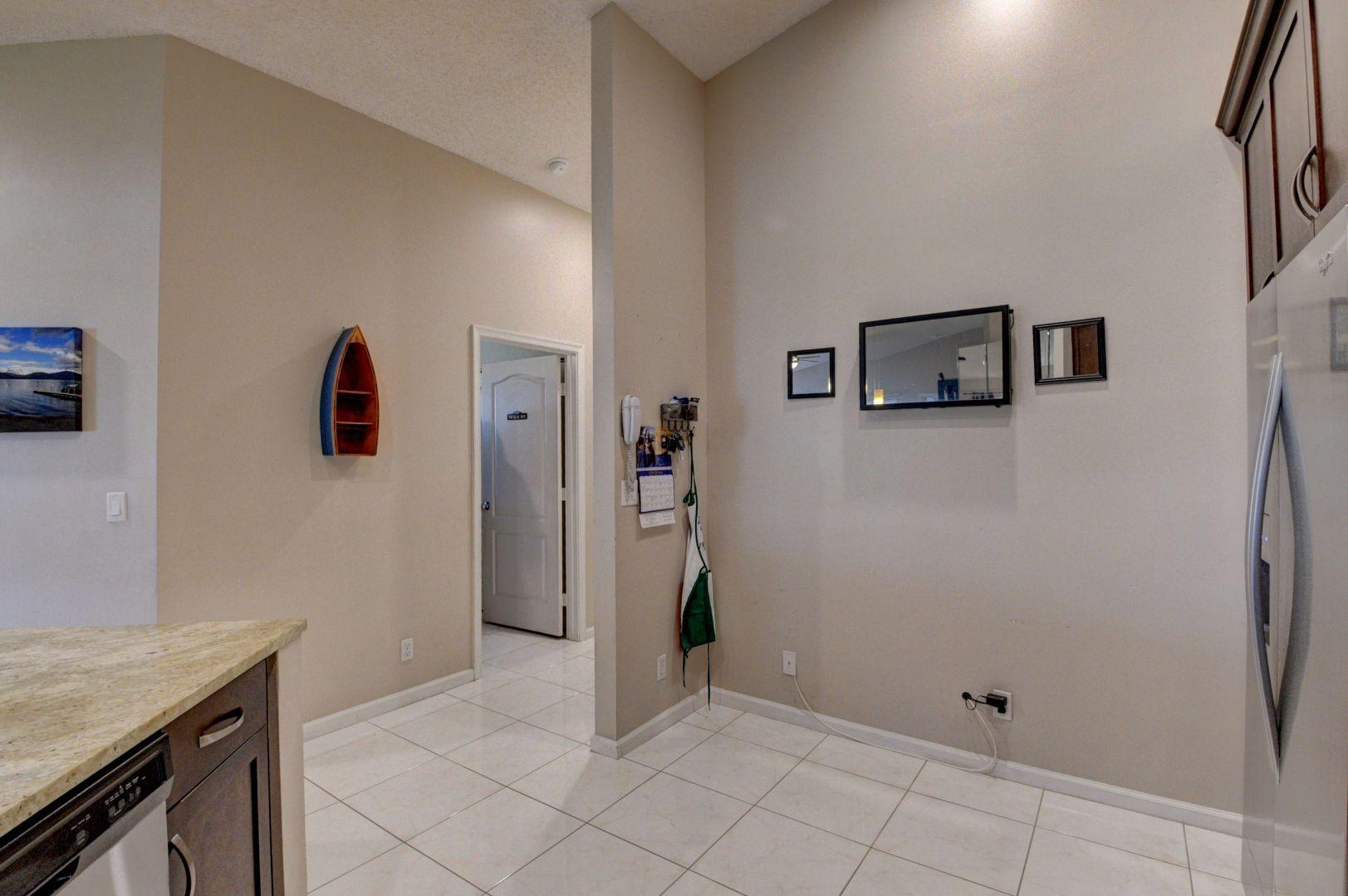 9238 Vineland Court, Unit G Boca Raton, FL 33496 - Photo 16 of 42 a view of a storage & utility room with a hallway