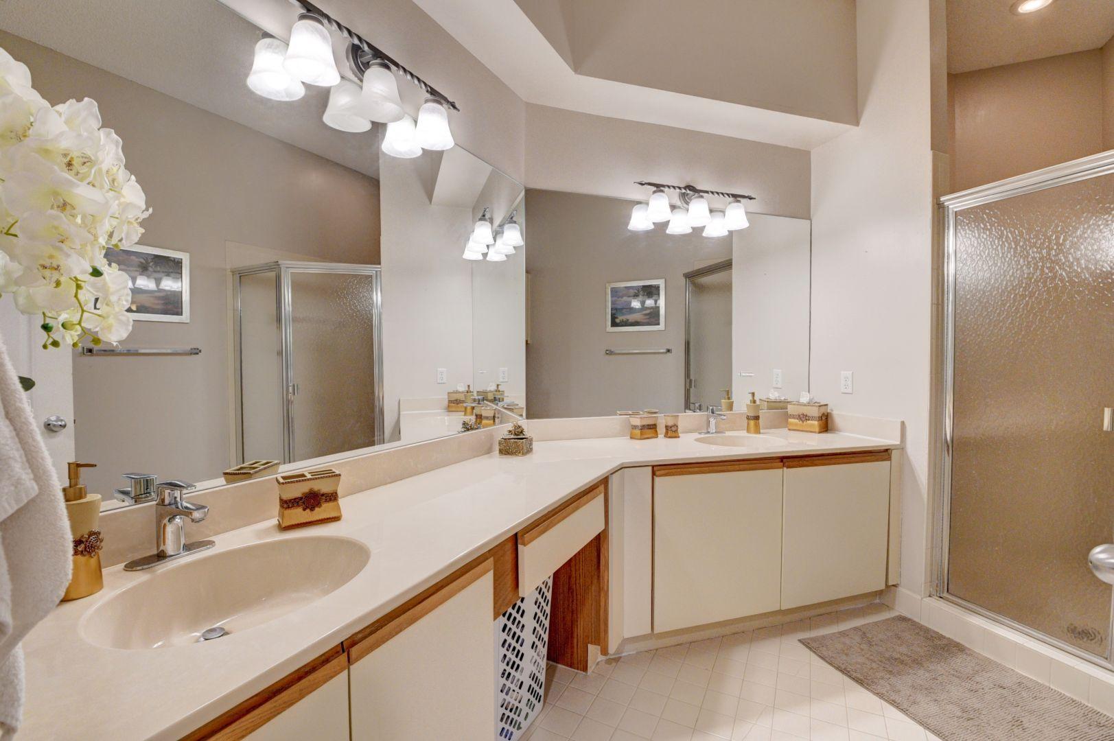 9238 Vineland Court, Unit G Boca Raton, FL 33496 - Photo 19 of 42 a bathroom with a sink double vanity and a mirror