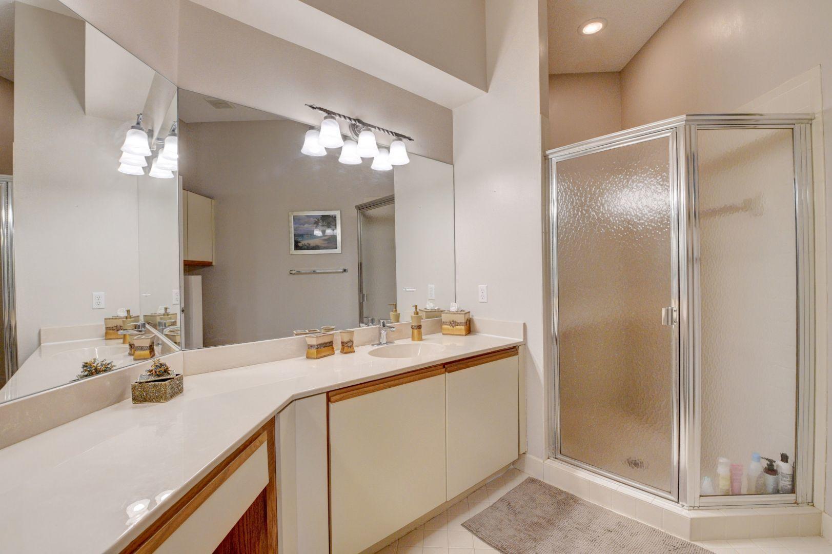 9238 Vineland Court, Unit G Boca Raton, FL 33496 - Photo 20 of 42 a bathroom with a sink double vanity and shower