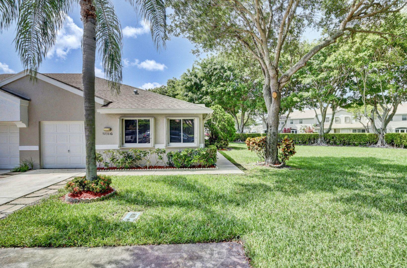 9238 Vineland Court, Unit G Boca Raton, FL 33496 - Photo 2 of 42 a view of a house with backyard and sitting area