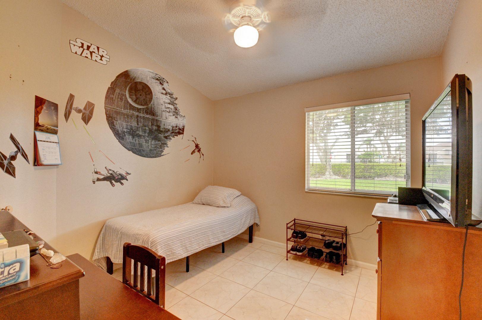 9238 Vineland Court, Unit G Boca Raton, FL 33496 - Photo 21 of 42 a living room with furniture and a flat screen tv